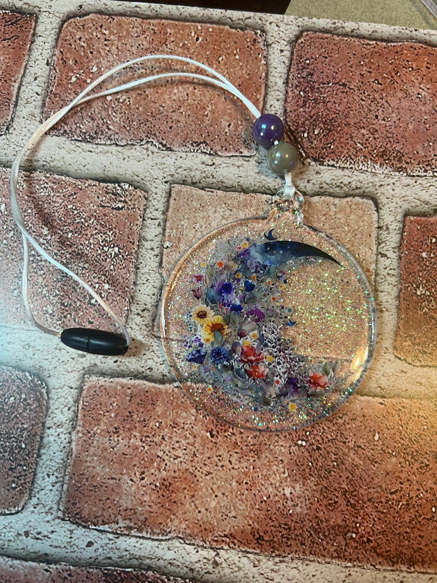 Clear blue floral moon car charm