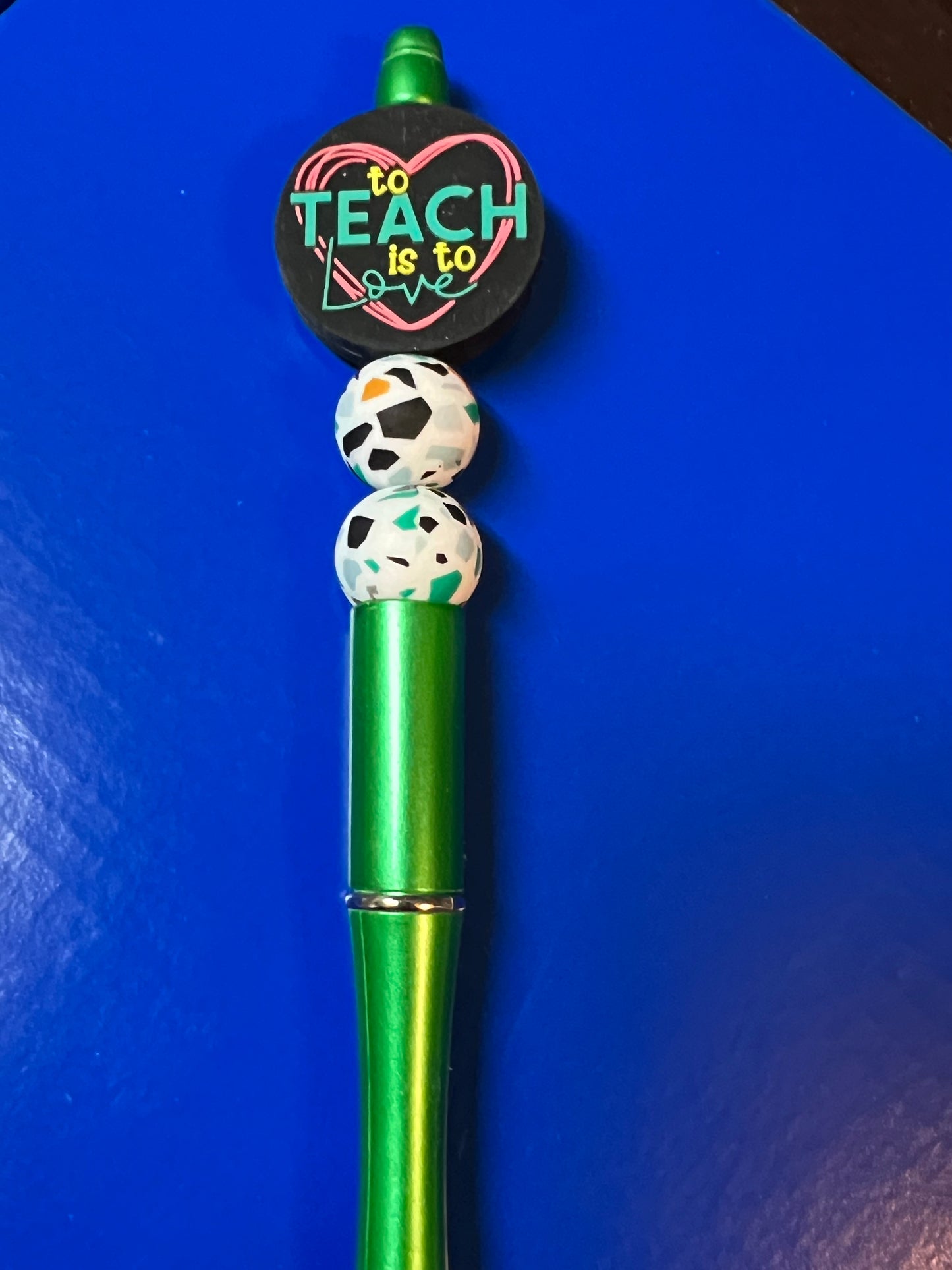 To teach is to love pen