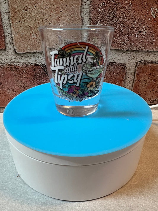 Tanned and tipsy shot glass