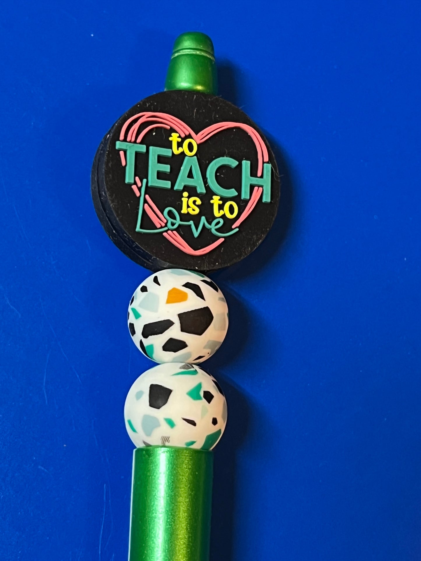To teach is to love pen